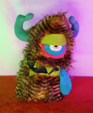 LARGE BROWN STRIPED ONE EYED MONSTER WITH HORNS & POCKET MOUTH